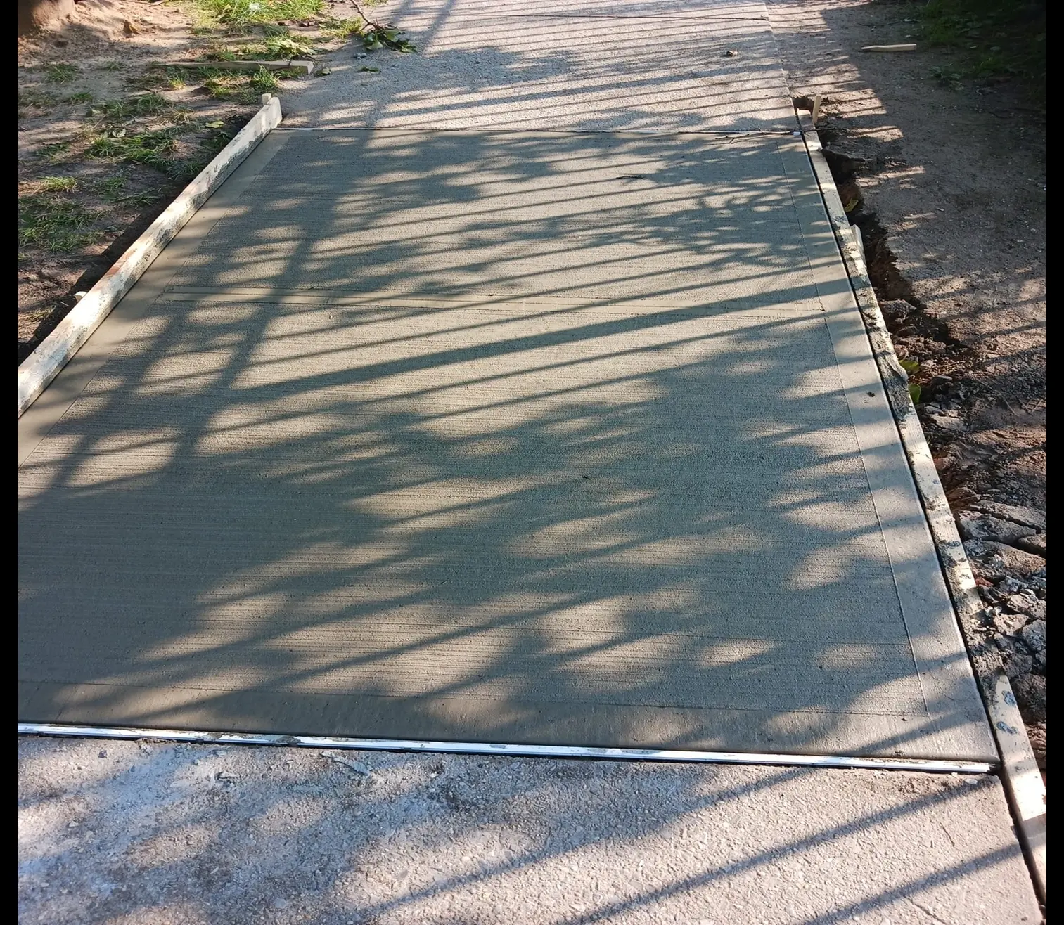 Concrete Sidewalk Fixed for a Smooth Surface in Queens