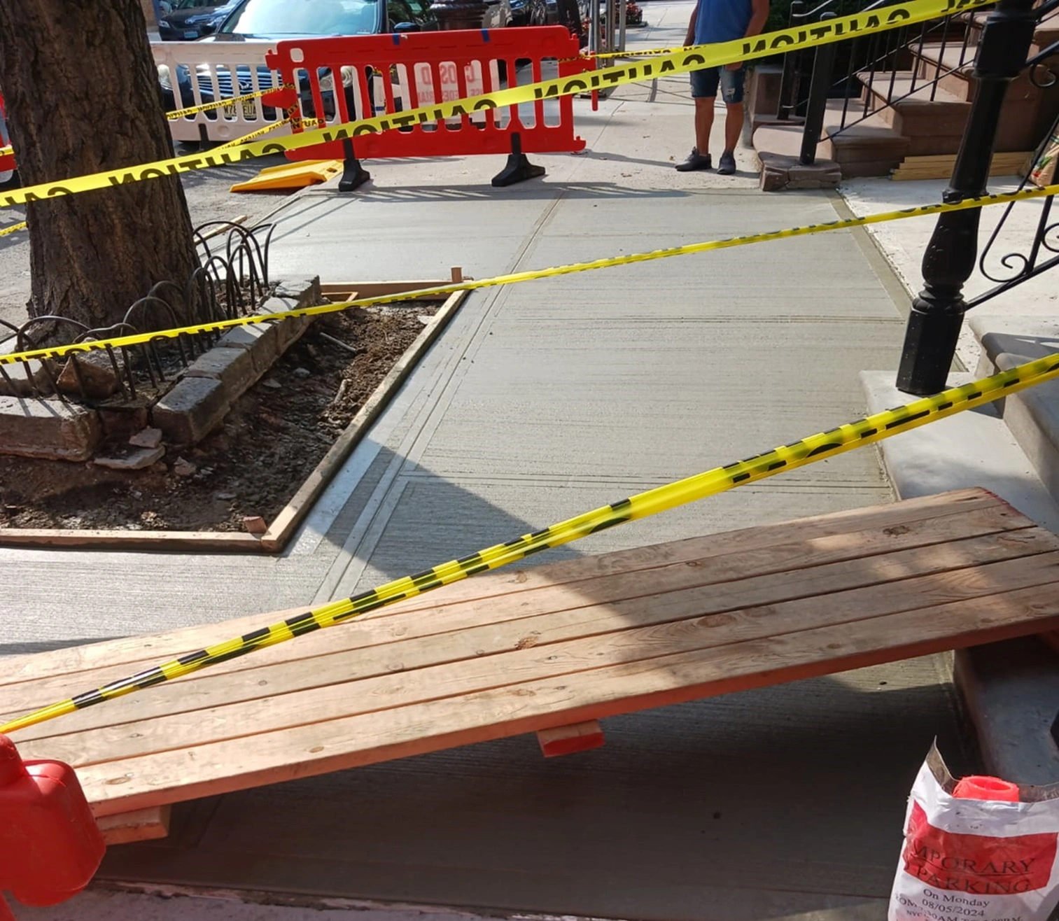 cracked Manhattan's concrete sidewalk repair